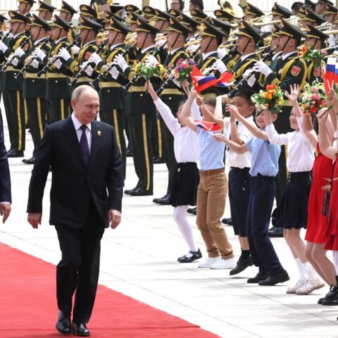 A military band welcomed the President with the Russian national anthem, and the Russian tricolor was hoisted over Tiananmen Square.